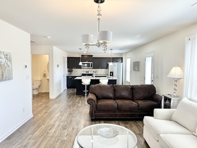 119 Lindsell Rd, Athens, TN 37303 - living room with light wood-type flooring and baseboards