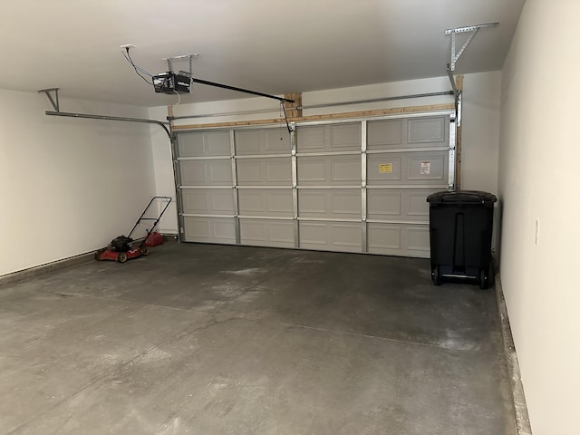 119 Lindsell Rd, Athens, TN 37303 - garage featuring a garage door opener and baseboards