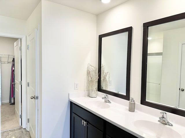119 Lindsell Rd, Athens, TN 37303 - bathroom featuring a walk in closet, a sink, and double vanity