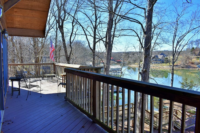 wooden deck featuring a water view