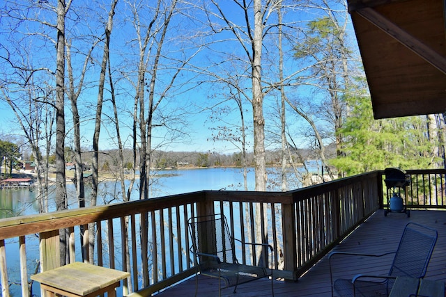 wooden deck featuring a water view