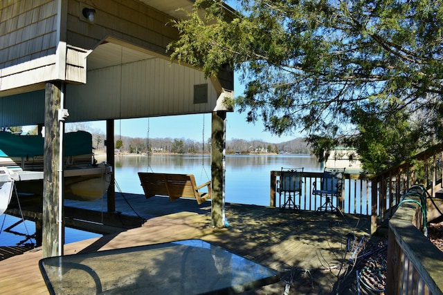 view of dock with a water view and boat lift