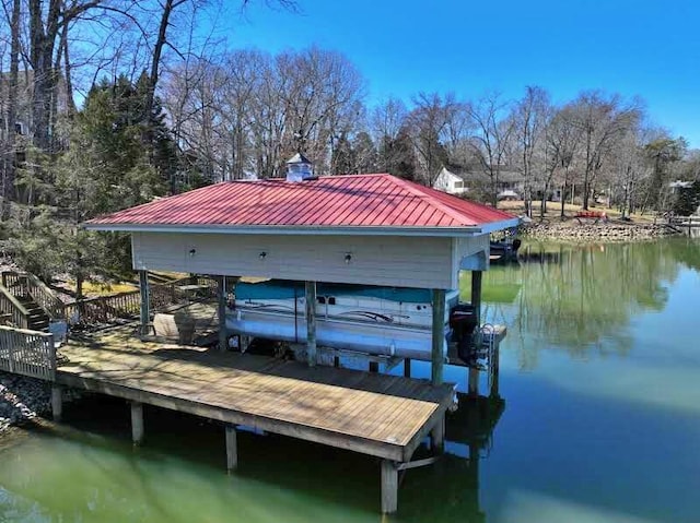 view of dock featuring a water view and boat lift