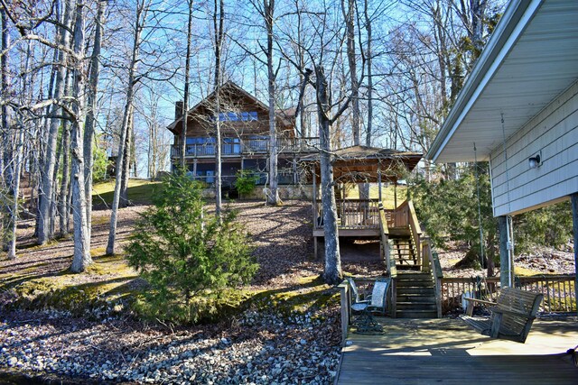 exterior space featuring stairway and a deck