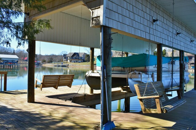 dock area featuring a water view and boat lift