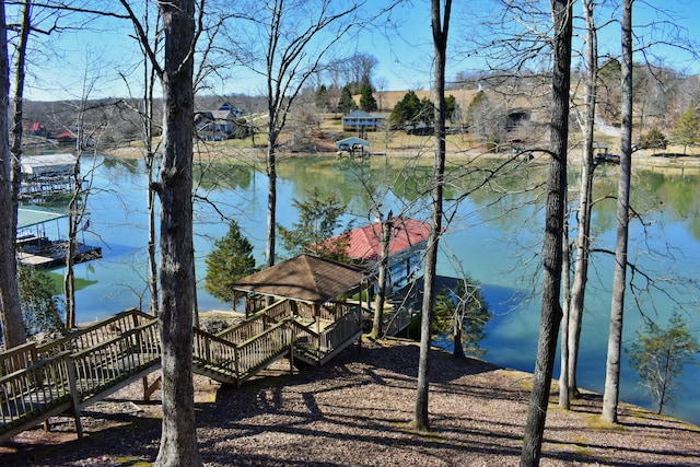 exterior space with a gazebo and a water view