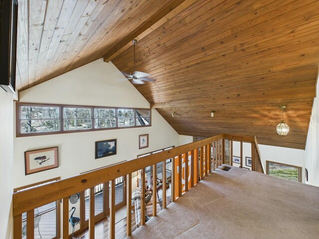 hallway featuring wood ceiling, high vaulted ceiling, carpet floors, and beam ceiling