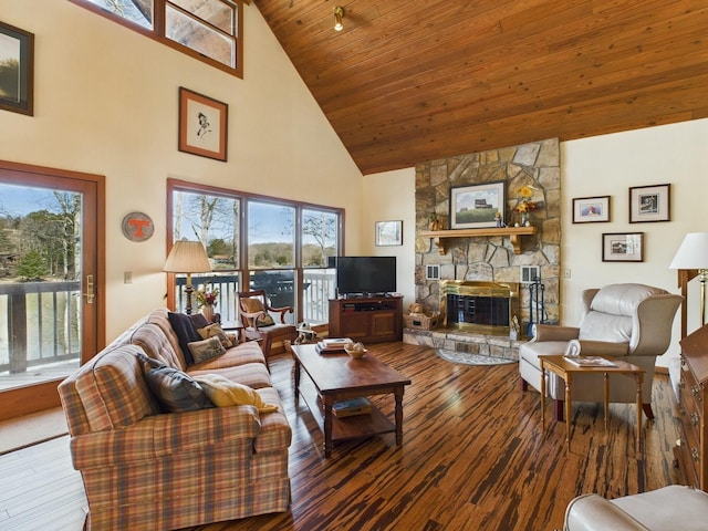 living room with wood ceiling, high vaulted ceiling, a fireplace, and hardwood / wood-style flooring