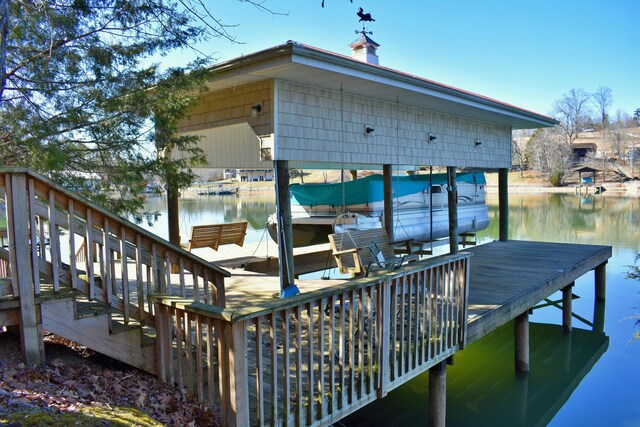 view of dock with a water view and boat lift