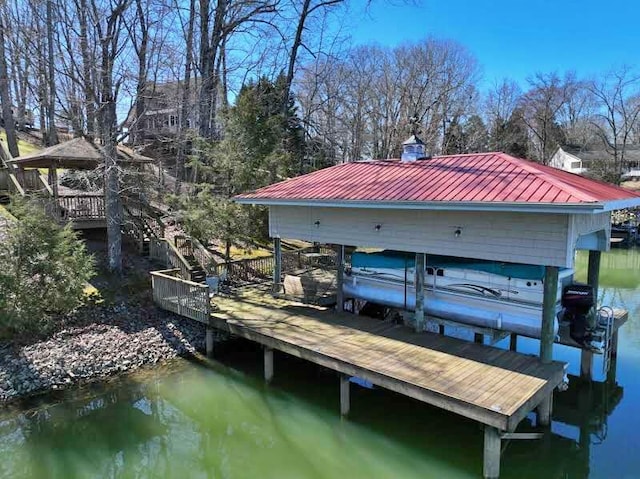 view of dock featuring a water view and boat lift