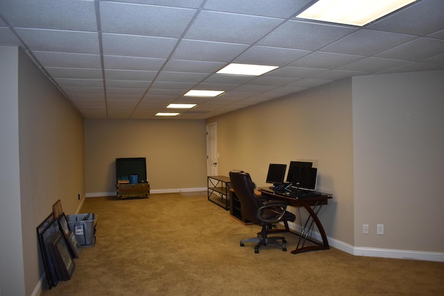 carpeted home office with a paneled ceiling and baseboards