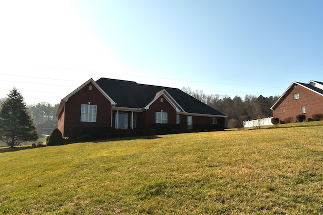 ranch-style home with a front lawn