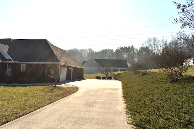 exterior space featuring concrete driveway