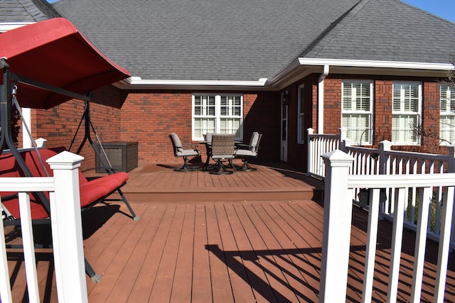 wooden deck with outdoor dining space