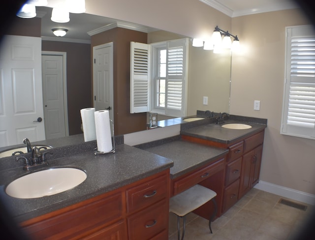 bathroom featuring vanity, baseboards, visible vents, and ornamental molding