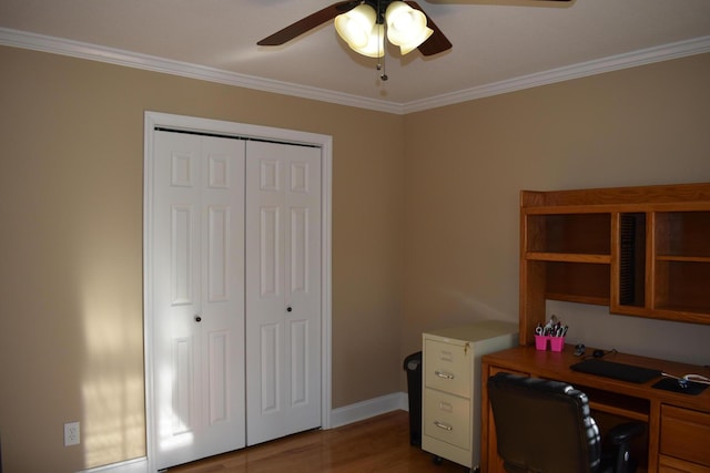 home office featuring ceiling fan, baseboards, wood finished floors, and crown molding