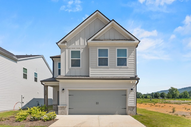 view of front of home with a front yard and a garage