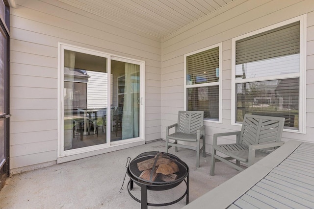 view of patio featuring an outdoor fire pit