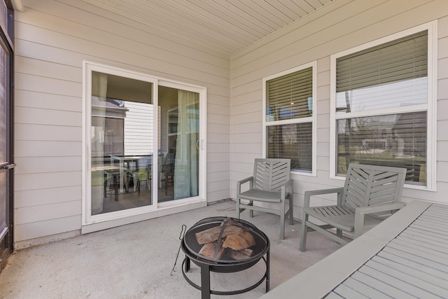 view of patio / terrace with an outdoor fire pit