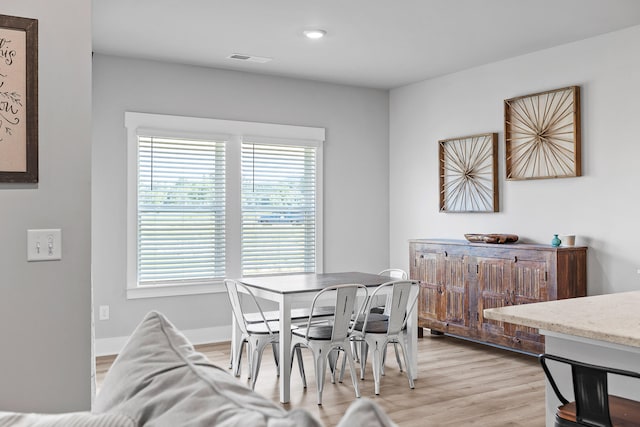 dining space featuring light hardwood / wood-style floors