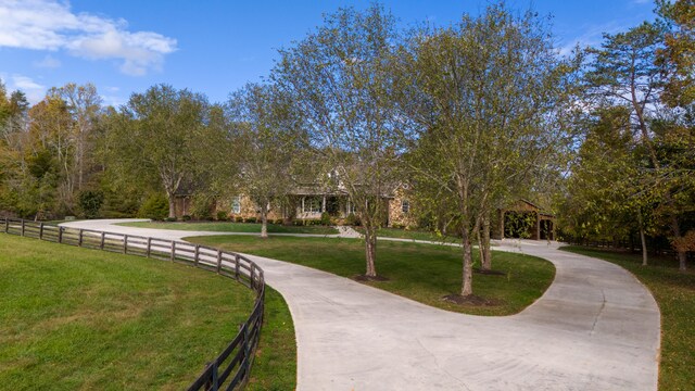 view of home's community featuring a lawn