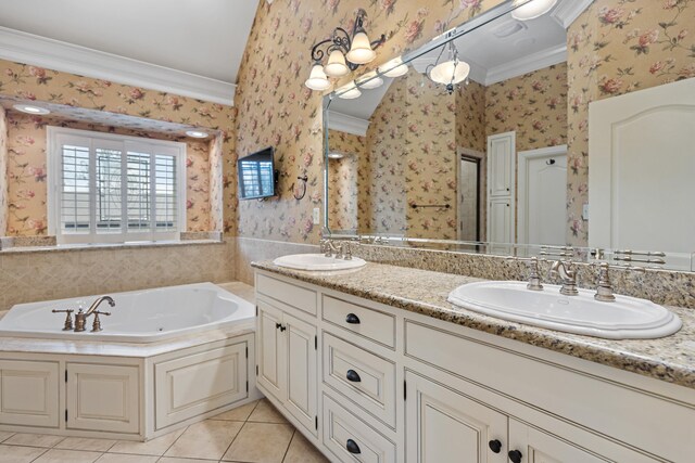 bathroom with a bathtub, tile patterned flooring, vanity, and ornamental molding