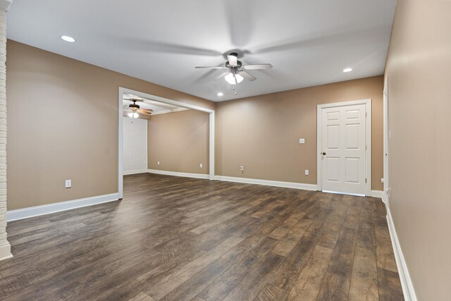 empty room with dark hardwood / wood-style flooring