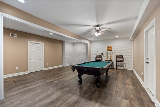 game room featuring dark hardwood / wood-style flooring, billiards, ceiling fan, and brick wall