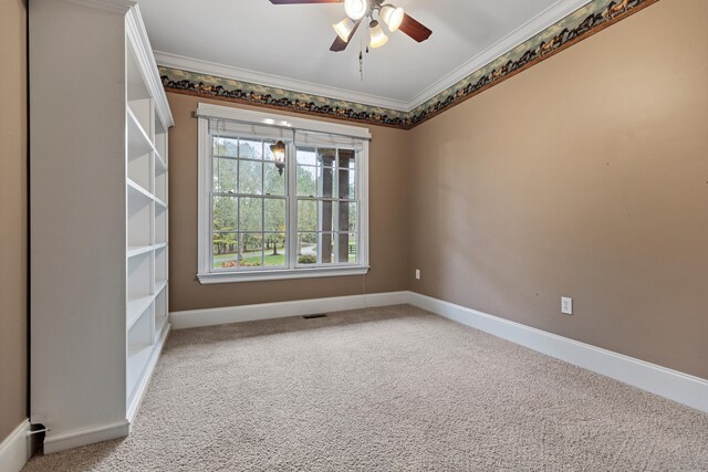 unfurnished room featuring carpet, ceiling fan, and crown molding