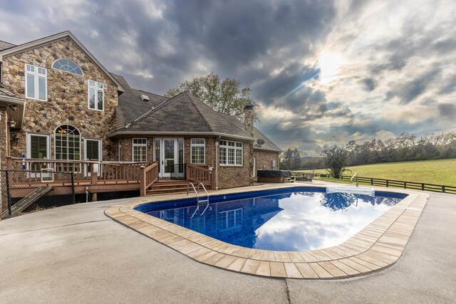 view of pool with a patio, a hot tub, and a deck