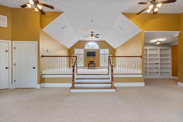 interior space with lofted ceiling and carpet floors