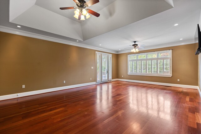 spare room with hardwood / wood-style floors, ceiling fan, and ornamental molding