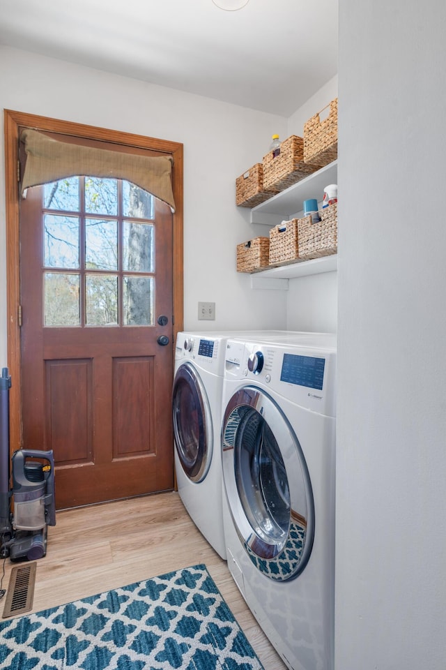 180 Mapleton Forest Dr NW, Cleveland, TN 37312 - laundry area with washer and clothes dryer and light wood-style flooring