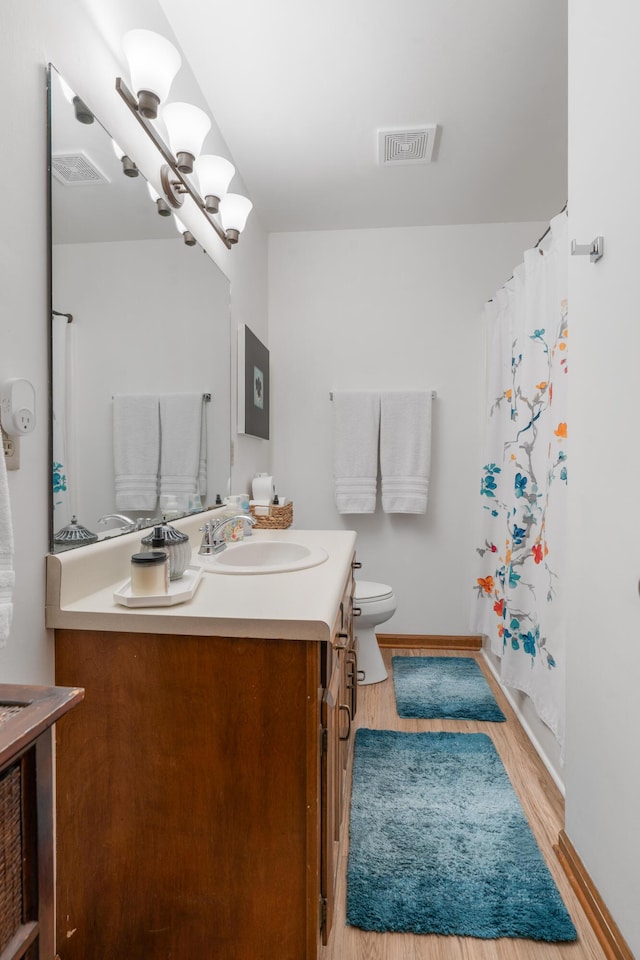 180 Mapleton Forest Dr NW, Cleveland, TN 37312 - bathroom featuring vanity, wood finished floors, and a shower with shower curtain