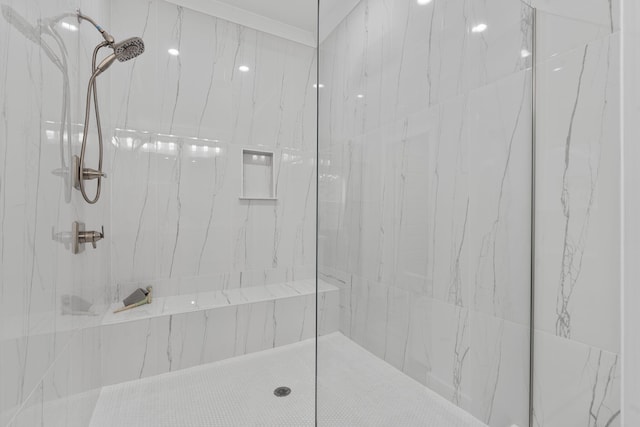 bathroom with tiled shower