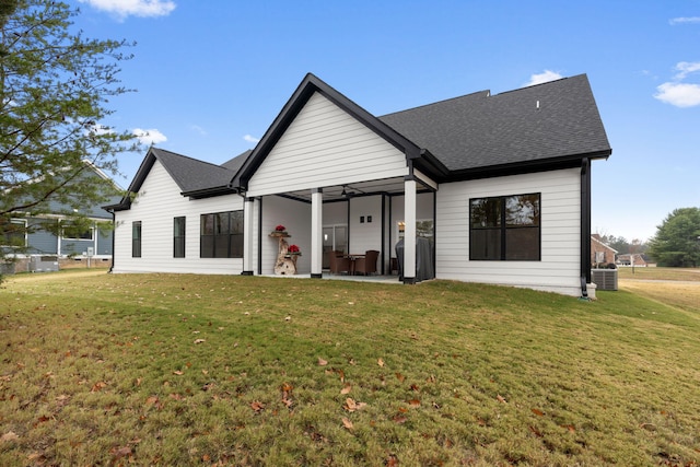 view of front of property featuring ceiling fan, a patio, a front yard, and central AC