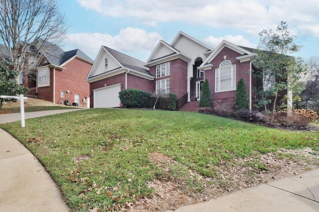 view of front of home with a front lawn and a garage