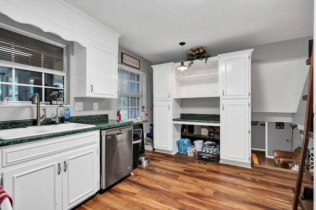 kitchen featuring sink, hardwood / wood-style floors, white cabinets, and dishwasher