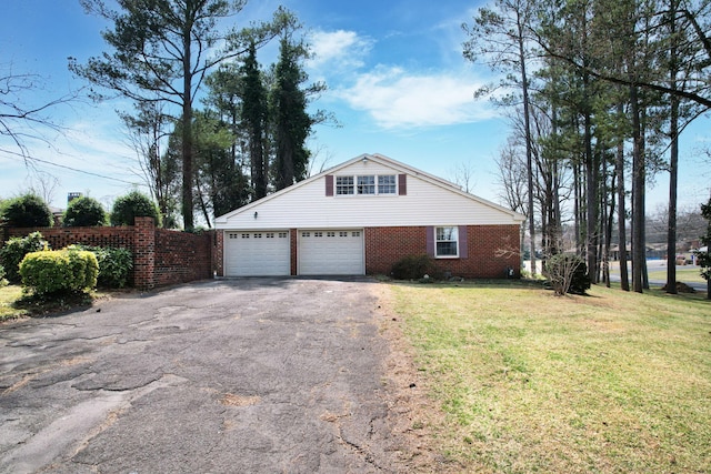 2408 Peerless Rd NW, Cleveland, TN 37311 - view of side of home with a yard, fence, brick siding, and driveway