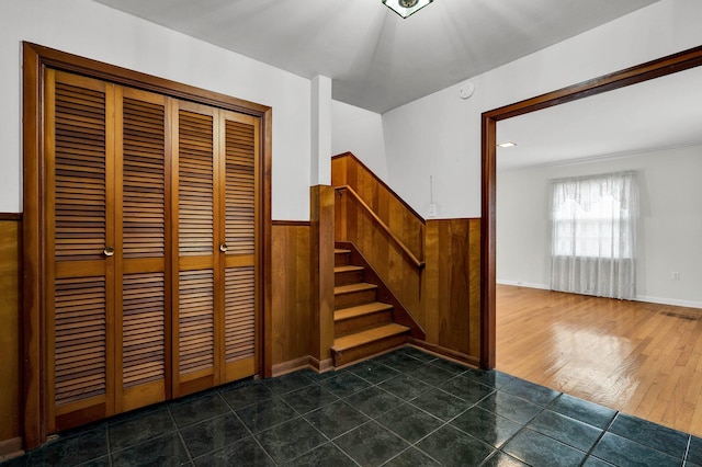 2408 Peerless Rd NW, Cleveland, TN 37311 - staircase with tile patterned floors, visible vents, wood walls, and wainscoting