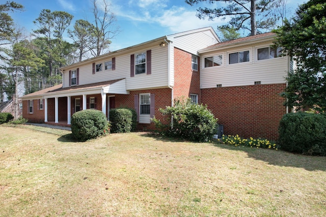 2408 Peerless Rd NW, Cleveland, TN 37311 - view of front of home with brick siding, covered porch, and a front yard