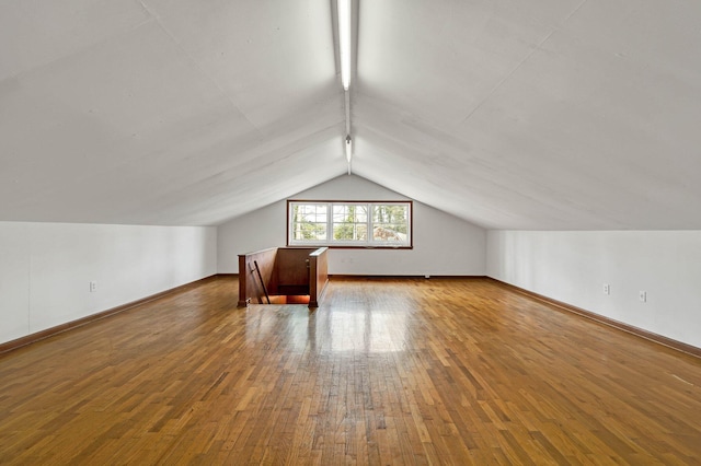 2408 Peerless Rd NW, Cleveland, TN 37311 - bonus room with baseboards, hardwood / wood-style floors, and vaulted ceiling
