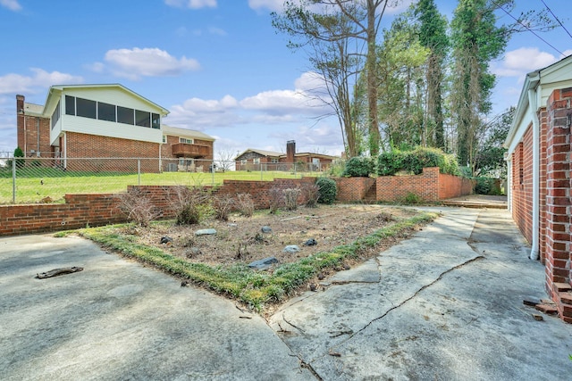 2408 Peerless Rd NW, Cleveland, TN 37311 - view of yard featuring a sunroom and fence