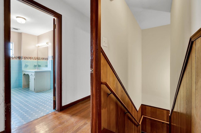 2408 Peerless Rd NW, Cleveland, TN 37311 - corridor with tile walls, light wood-style floors, a wainscoted wall, and visible vents