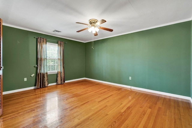 2408 Peerless Rd NW, Cleveland, TN 37311 - empty room featuring visible vents, baseboards, ceiling fan, ornamental molding, and wood finished floors