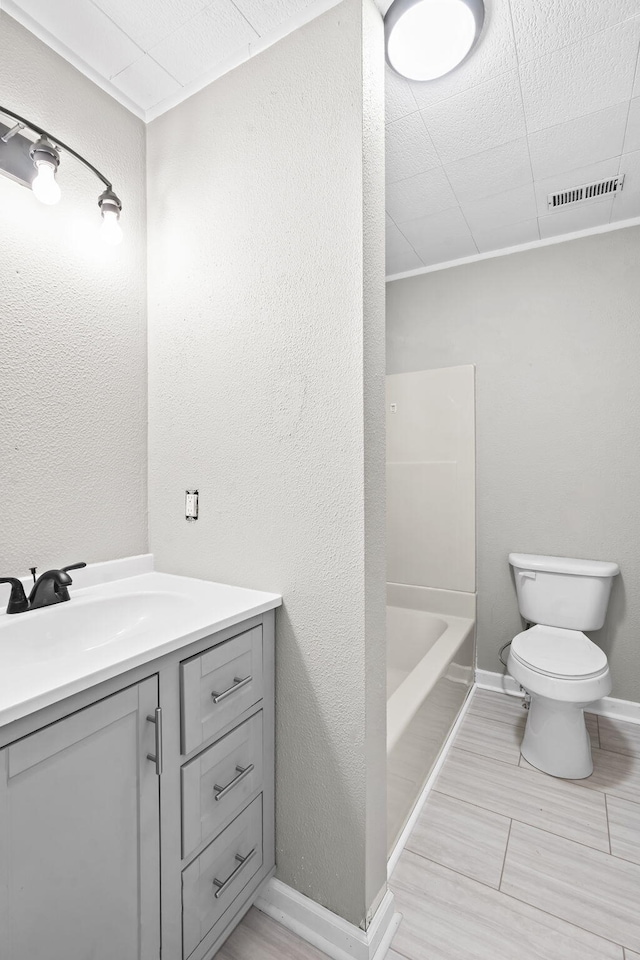 full bathroom with vanity, shower / bathtub combination, and toilet