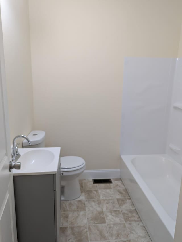 2811 E 26th St, Chattanooga, TN 37407 - full bath with toilet, vanity, a bathtub, and baseboards
