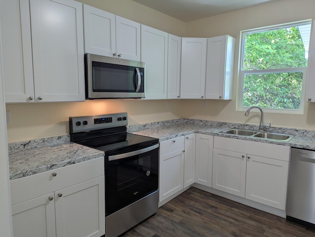2811 E 26th St, Chattanooga, TN 37407 - kitchen featuring stainless steel appliances, a sink, and white cabinetry