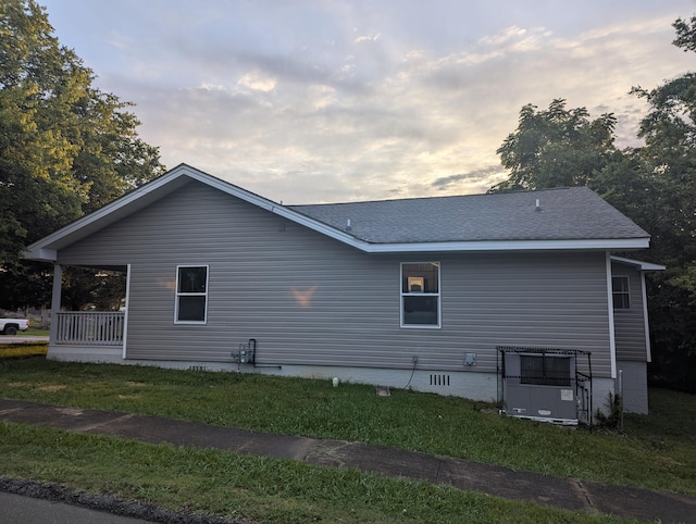 2811 E 26th St, Chattanooga, TN 37407 - property exterior at dusk featuring a yard and a shingled roof