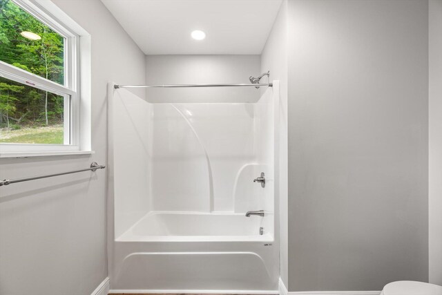 1523 Eads Bluff Rd NW, Georgetown, TN 37336 - bathroom with  shower combination, baseboards, plenty of natural light, and toilet
